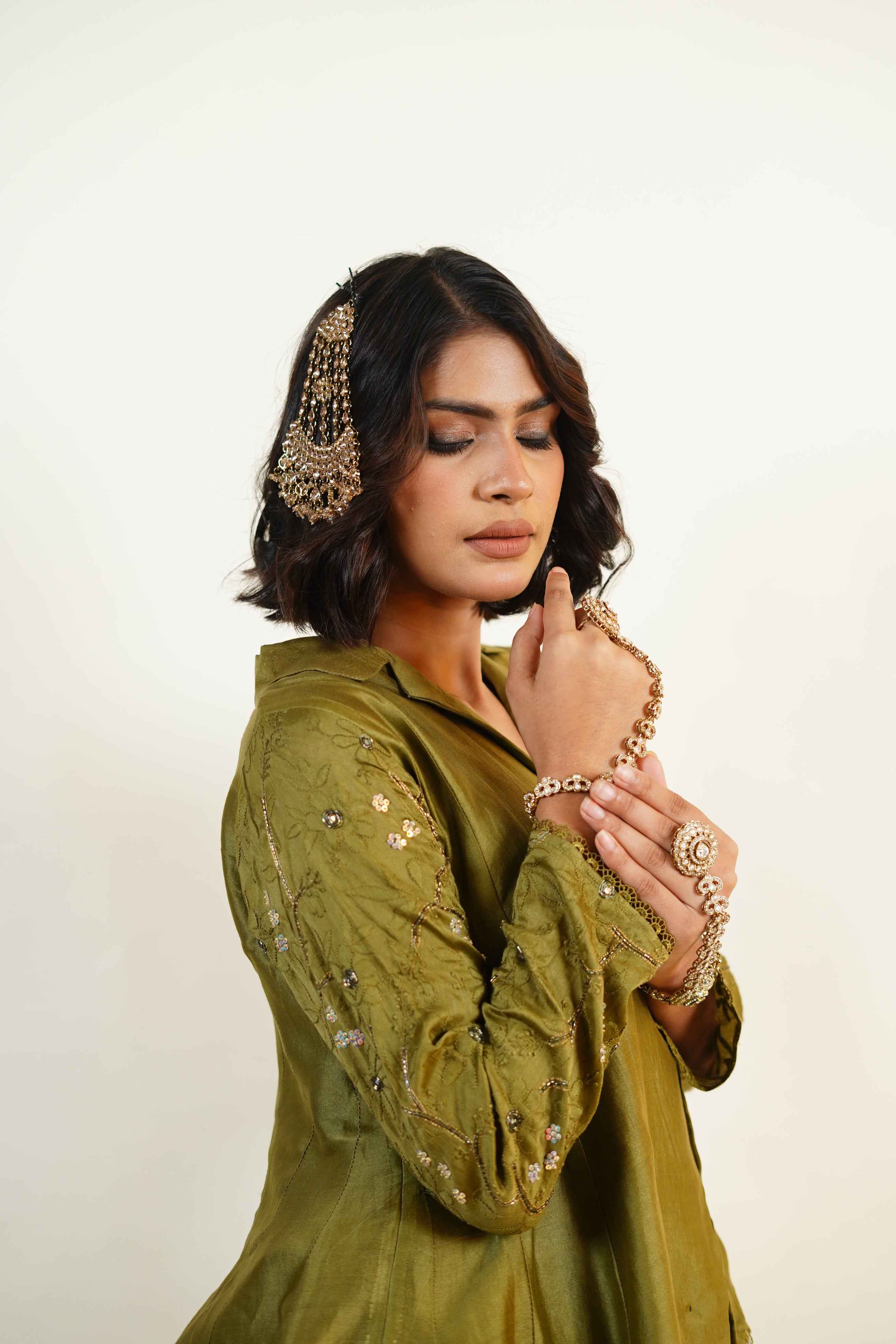 Hoor-Deep Olive green chikankari and zardozi handcraftrd caot collar asymmetrical palazzo set